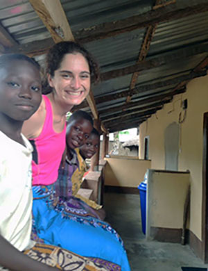 Leah Genn on porch with Togo neighbors