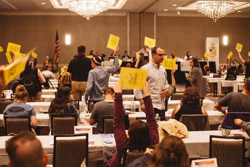 Holding up placards during Grand Chapter