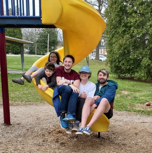 Members and Benny on a slide